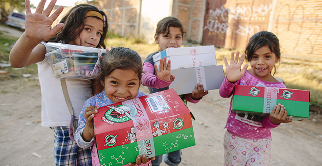 Children receive their gifts from Operation Christmas Child