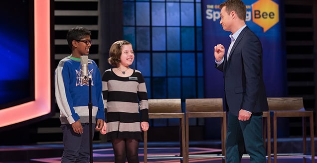 'Spelling Bee' host Grant Denyer and two contestants