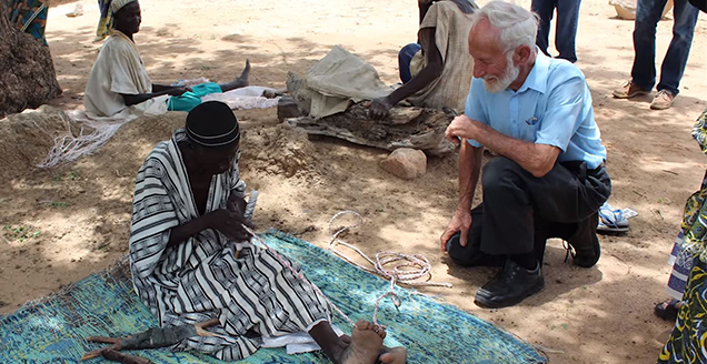 Dr Elliott visiting a Burkinabese woman