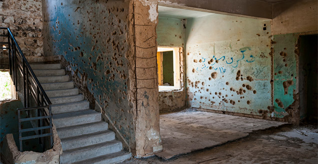 A bullet-scarred building in Quneitra, Syria.