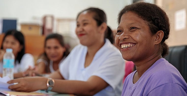 Shirley (right) takes part in a health worker meeting in Camarines Norte, Philippines.