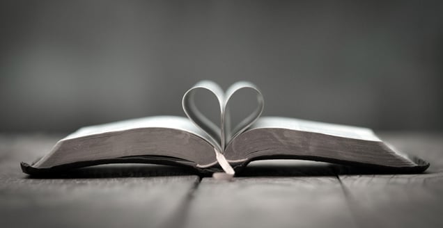 Bible with pages in the shape of a heart