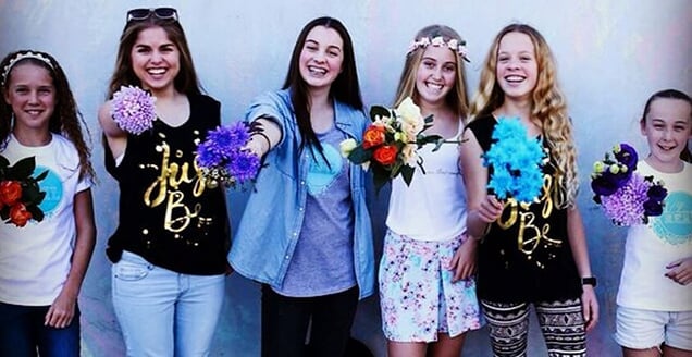 Young women wearing ChooseREAL clothing