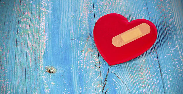 Red heart with bandaid