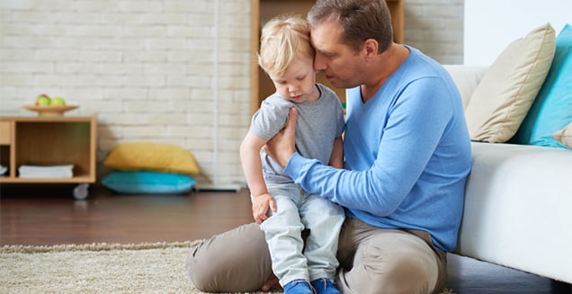 A Father consoling his son