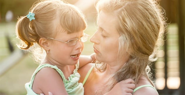 A mother consoling her daughter