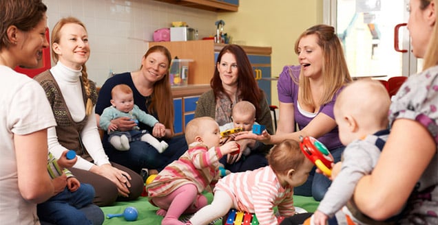Group Of Mothers With Babies At Playgroup