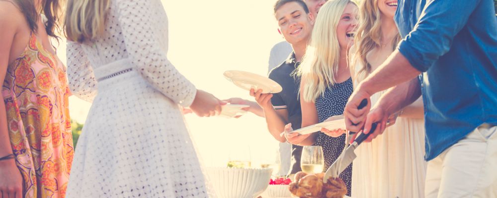 People gathering around shared meal