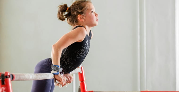 Teenage girl practising gymnastics