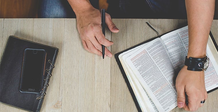 Young Man reading a Bible