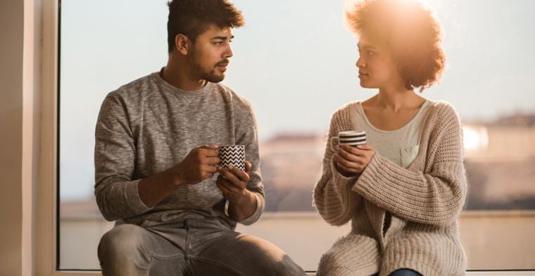 Couple sit and chat
