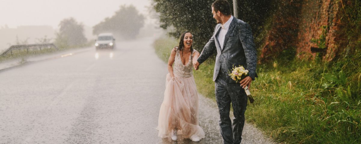Wedding couple in rain
