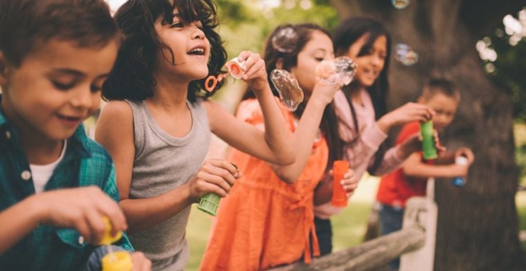 Kids blowing bubbles