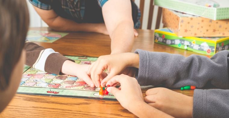 Kids play boardgame