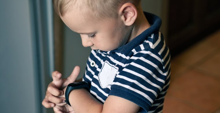 Boy wearing tracking device -