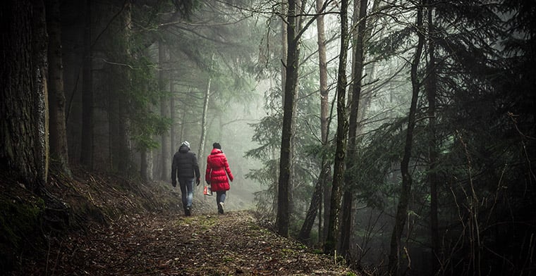 Couple walking in forest
