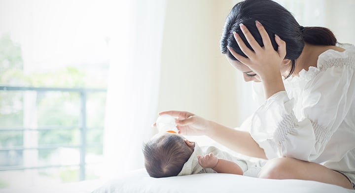 Mother feeding her baby