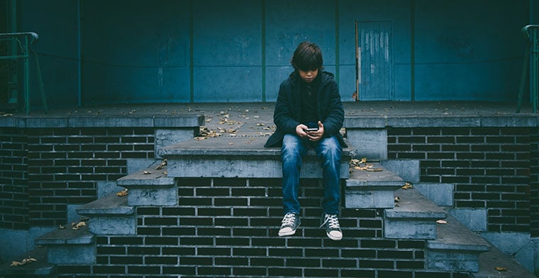 Teen boy texting