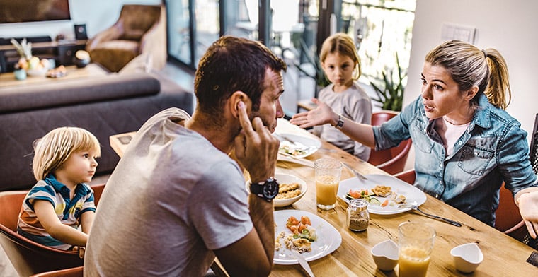 Young couple arguing at dinner