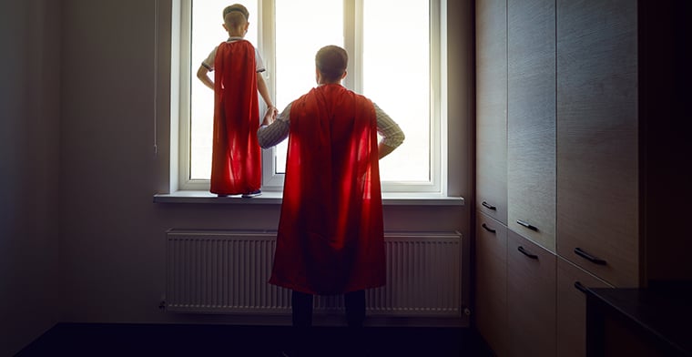 Father and son at the window in the room