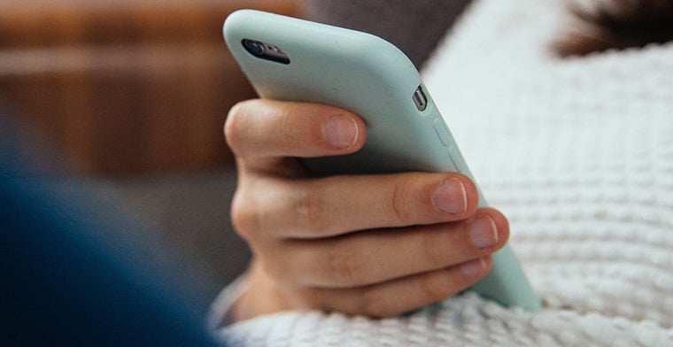 Young woman using phone