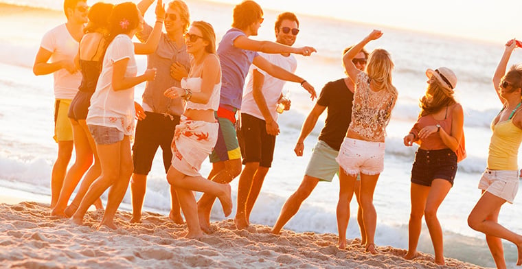 Group Of Young People At Beach Party