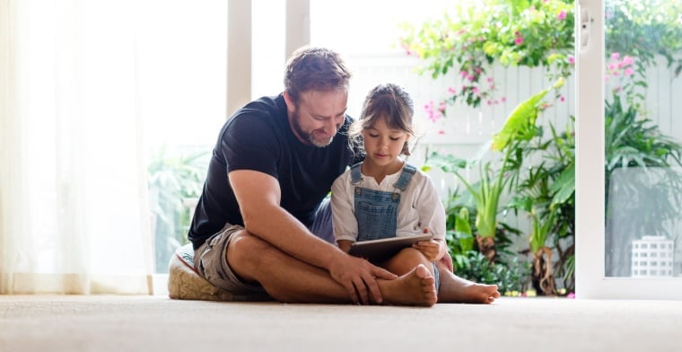 Dad and Daughter Reading at home