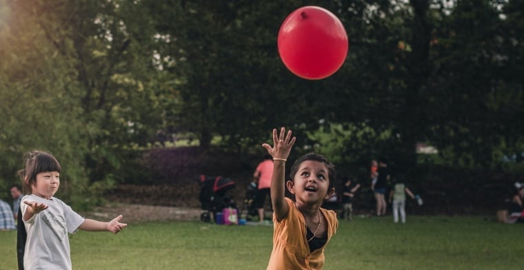 Children playing with balloon by alaric-sim-