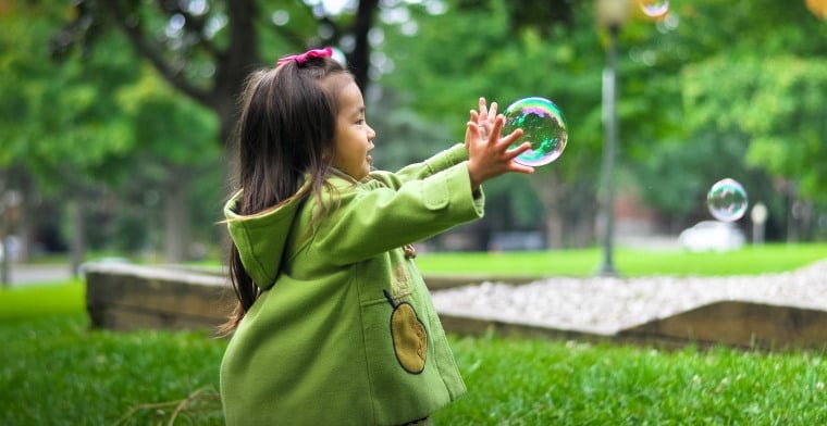 Little girl playing with Bubbles by leo-rivas-