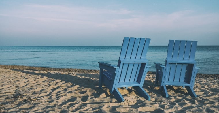 Two Blue Deck Chairs on Beach -