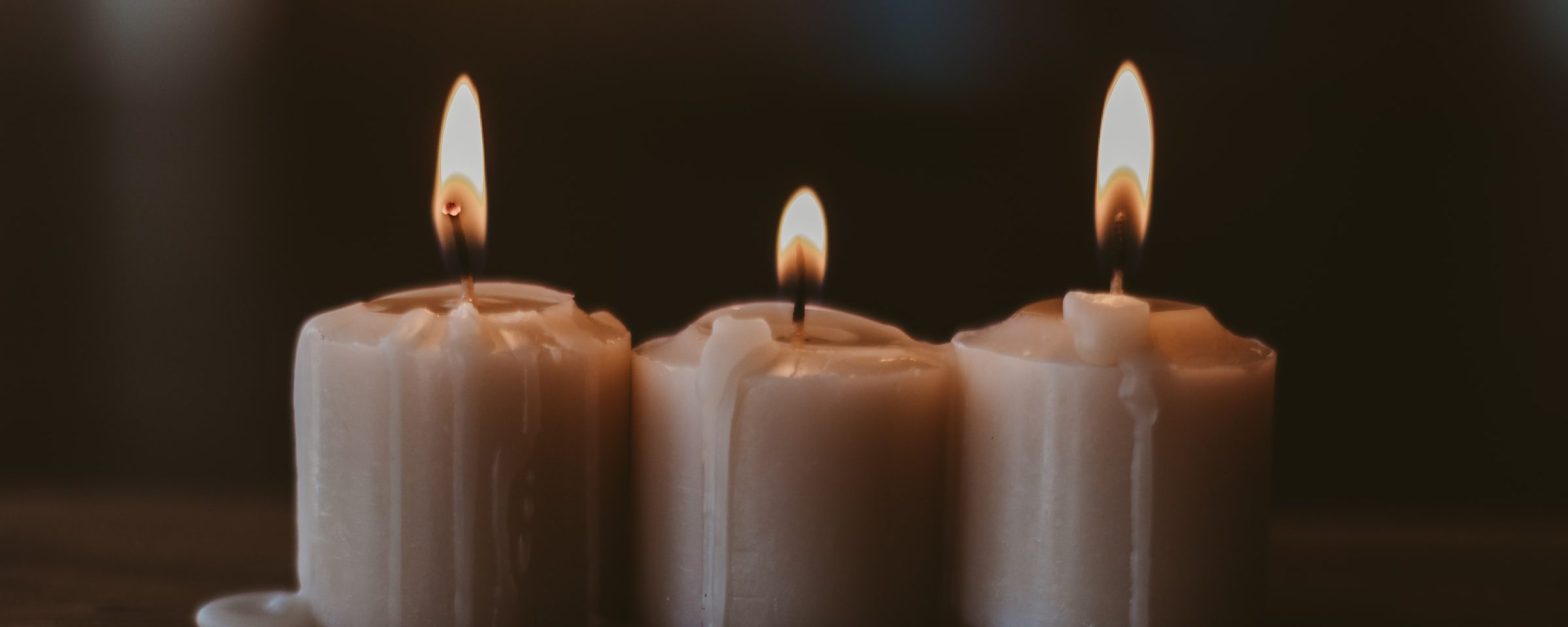 Three lit candles