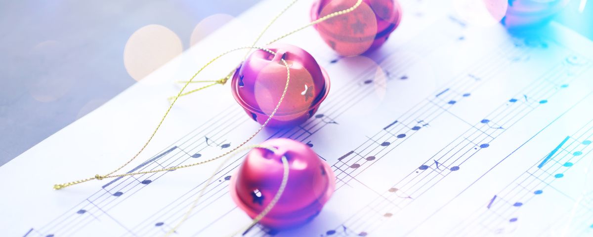 Christmas Carols with tree decorations on sheet music (1)