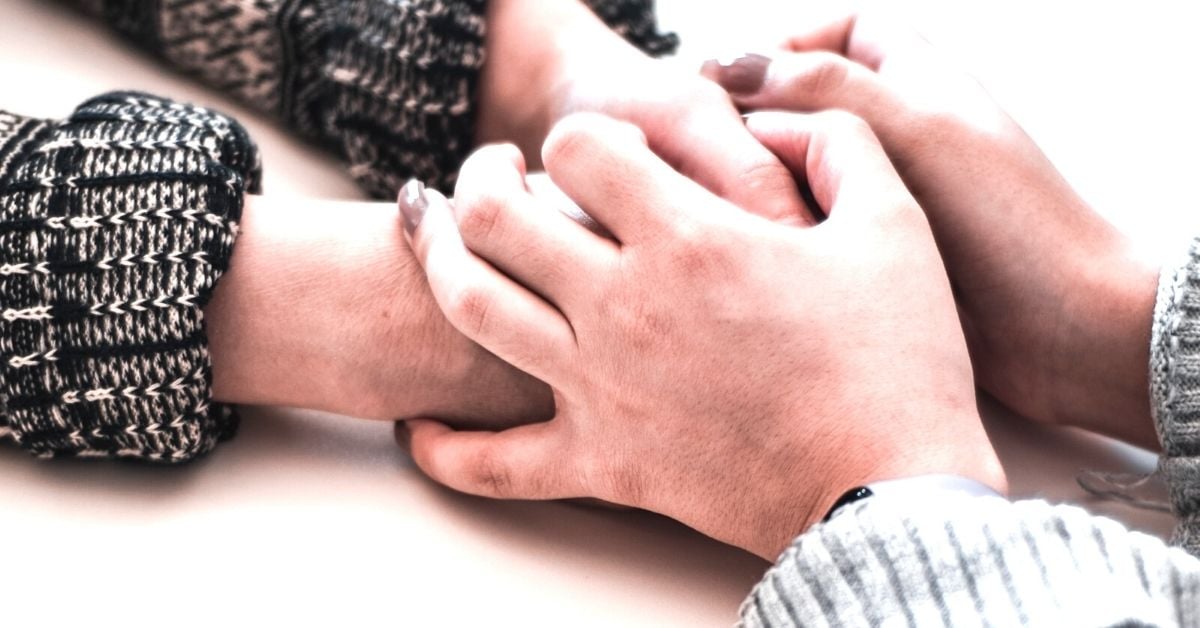 Holding onto each others hands - 
