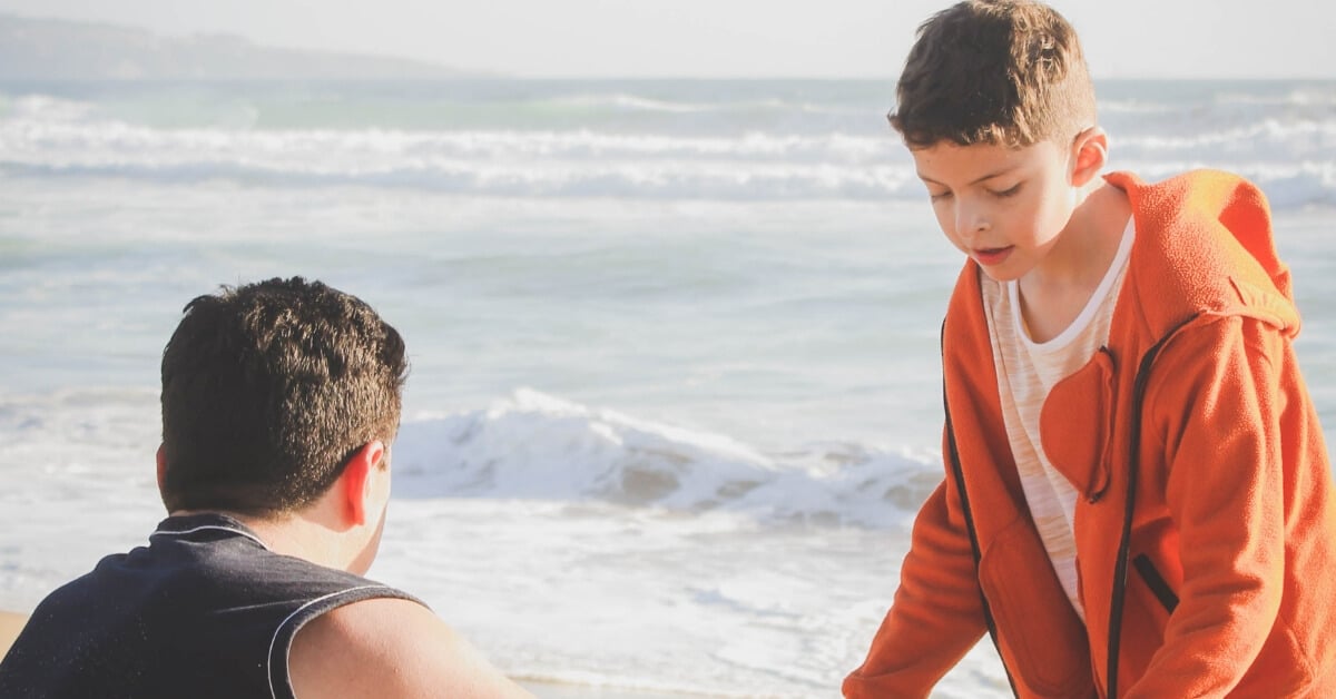dad and son at the beach