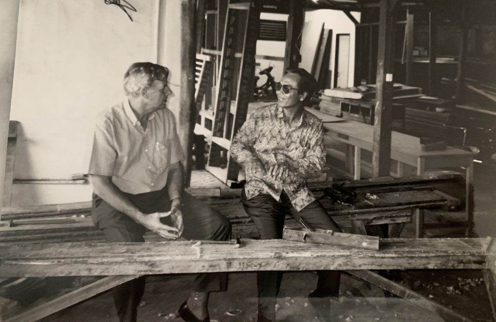 Opportunity International Australia cofounder David with business owner in Indonesia in the 70s