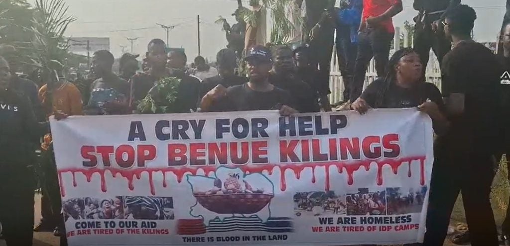 Young people protesting the violent Benue attacks , Nigeria 2025