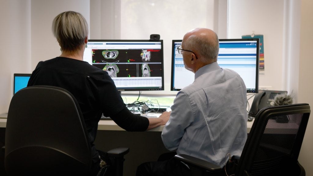 Prof John Boyages Reviewing Breast Cancer Scans_Conquering Breast Cancer_Copyright Moonshine Agency